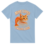Light Blue t-shirt printed with Trippi Troppi and the words Nine lives, twelve legs, front view