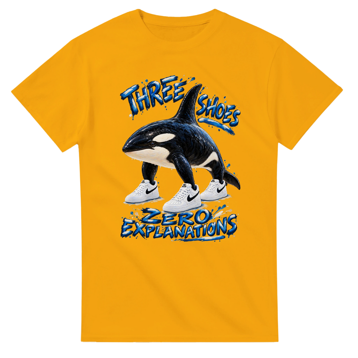 Gold t-shirt printed with Orcalero Orcala and the words Three shoes, zero explanations, front view