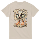 Sand t-shirt printed with La Vaca Saturno Saturnita and the words Farm girl, galactic problem, front view