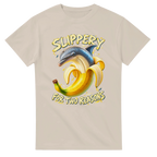 Sand t-shirt printed with Bananita Dolphinita and the words Slippery, for two reasons, front view