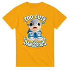 Gold t-shirt printed with Los Tralaleritos and the words Too cute, too dangerous, front view