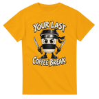 Gold t-shirt printed with Cappuccino Assassino and the words Your last coffee break, front view