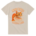 Sand t-shirt printed with Trippi Troppi and the words Nine lives, twelve legs, front view