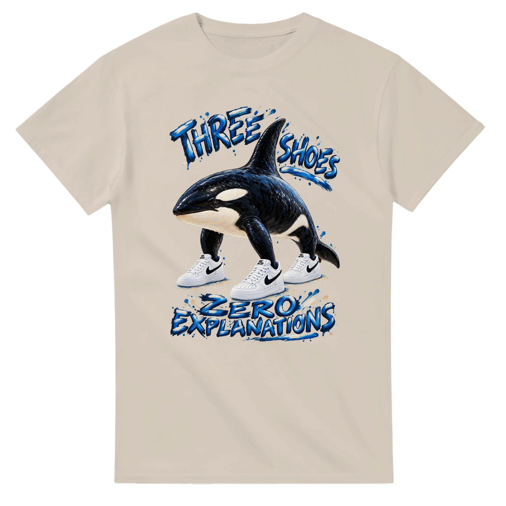 Sand t-shirt printed with Orcalero Orcala and the words Three shoes, zero explanations, front view