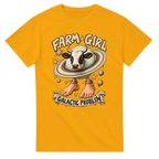 Gold t-shirt printed with La Vaca Saturno Saturnita and the words Farm girl, galactic problem, front view